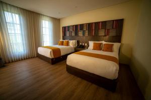 Postel nebo postele na pokoji v ubytování Hotel Dex Tlaquepaque + 28 fotografií