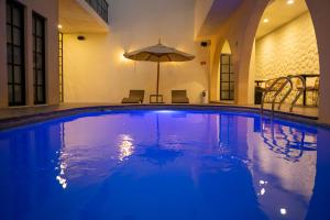 Bazén v ubytování Hotel Dex Tlaquepaque nebo v jeho okolí