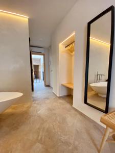 a bathroom with a sink and a mirror at VICTORIA - Adults Only by Ático73 in Medina Sidonia
