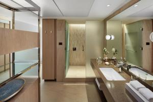 a bathroom with a sink and a shower at Mandarin Oriental, Santiago in Santiago