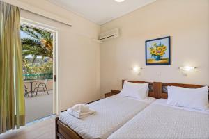 Katil atau katil-katil dalam bilik di Lefktron Hotel