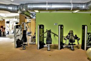 a gym with several rows of exercise bikes in it at Bella Sirena 304-A - Elegant Oceanview Condo on Sandy Beach in Puerto Peñasco