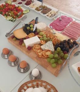 a table full of cheese and other foods on a table at The Maltese Sun in Sliema