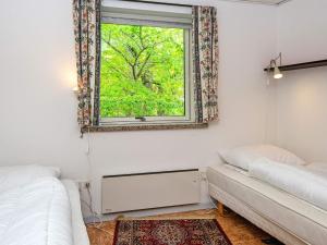 En eller flere senge i et værelse på 6 person holiday home in Glesborg