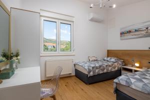 Postel nebo postele na pokoji v ubytování Villa Loni Trogir Marina with pool 55 m2 - 3 e-bike free use