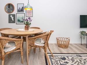 a dining room with a table and chairs at 4 person holiday home in Fan in Fanø