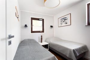 Posteľ alebo postele v izbe v ubytovaní Szumiwoda Apartamenty Kuźnica