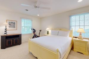 a bedroom with a large white bed and windows at Town of Rehoboth Beach 49 Delaware Ave in Rehoboth Beach