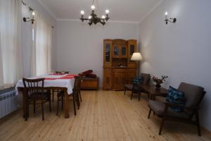 a dining room with a table and chairs at Toon 55 Boutique Hotel in Gyumri