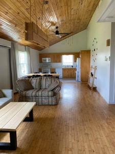 a large living room with a couch and a table at Loft apartment in Kensington in Kensington