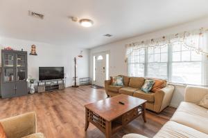 a living room with a couch and a table at Atlantic City-Waterfront Park-Amazing 360 views in Atlantic City