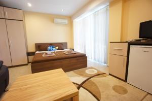 Ένα ή περισσότερα κρεβάτια σε δωμάτιο στο Kabakum Holiday Studio