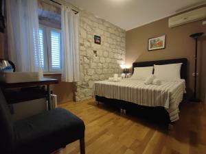 Postel nebo postele na pokoji v ubytování Carol Rooms