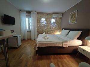 Postel nebo postele na pokoji v ubytování Carol Rooms