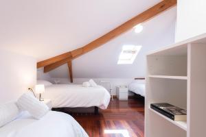 Postel nebo postele na pokoji v ubytování CASA PLAYA DE LIMENS