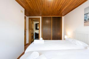 Postel nebo postele na pokoji v ubytování CASA PLAYA DE LIMENS