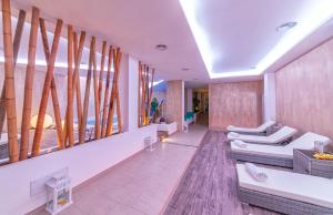 a living room with couches and a large window at Royal Sunset Hotel in Ischia