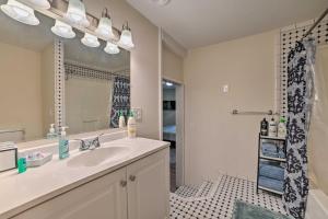 a bathroom with a sink and a shower at Vacation Rental In-Between Houghton and Higgins Lake in Houghton Lake +16 photos