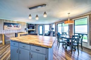 a kitchen and dining room with a table and chairs at Mtn Treehouse with Fire Pit, Breathtaking Views in Waynesville