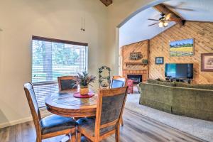 a dining room with a table and chairs and a couch at Cozy Pagosa Springs Retreat Fire Pit and Patio in Pagosa Springs