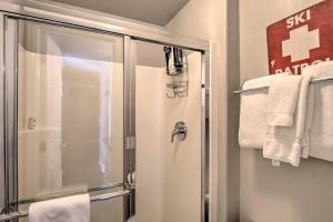 a shower with a glass door in a bathroom at 1 Mi to Quandary Trail Idyllic Breckenridge Cabin in Breckenridge +19 photos