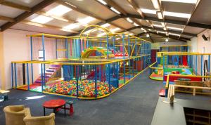 a play room with two slides and a play structure at The Inn at Dromoland in Newmarket on Fergus