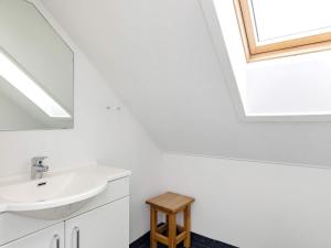 a bathroom with a sink and a skylight at 8 person holiday home in Brenderup Fyn-By Traum in Bro