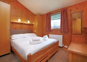 Un pat sau paturi într-o cameră la Hartsop Fold