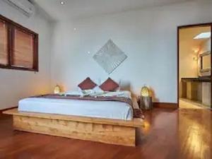 a bedroom with a large bed in a room at Villa Mimpi Manis infinity pool&180°Ocean view in Amed +19 photos
