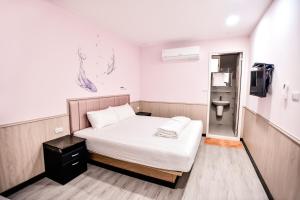Letto o letti in una camera di Ye Yuan Star Homestay