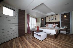 Postel nebo postele na pokoji v ubytování Zambala Retreat & Spa Darjeeling