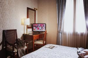 Postel nebo postele na pokoji v ubytování Hotel Ca' D'Oro - WENICE Deep Culture