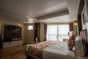 Postel nebo postele na pokoji v ubytování Zambala Retreat & Spa Darjeeling