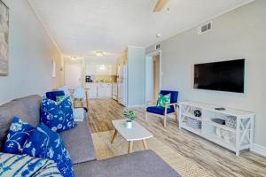 a living room with a couch and a flat screen tv at Windy Village C-6 in Myrtle Beach