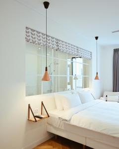 מיטה או מיטות בחדר ב-Hygge Kro