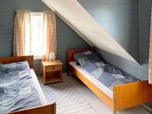 Кровать или кровати в номере Three-Bedroom Holiday home in Svelgen