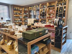 a store filled with lots of bottles of wine at AKRON Luxury Holidays in Ancient Epidauros
