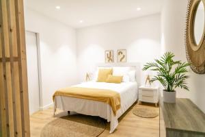 Posteľ alebo postele v izbe v ubytovaní Apartamentos Mareira (con vistas al mar)