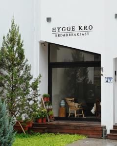 a store front with a christmas tree in the window at Hygge Kro in Hualien City