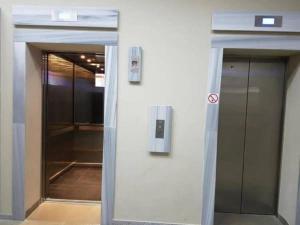 a white wall with a door in a building at Apartment in Orbi Sea Tower in Batumi