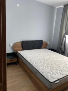 a bed in a room with a mattress at Rose in Karlovo