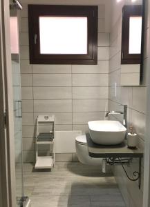 Koupelna v ubytování Appartamenti via cala sisine