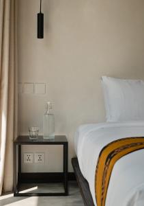 Voodi või voodid majutusasutuse DUNIA LOMBOK - Villas with Ocean View toas