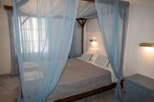 A bed or beds in a room at Irene Hotel Leros