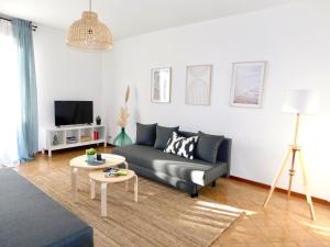 a living room with a couch and a table at Casa Azzurra in Marzocca di Senigallia