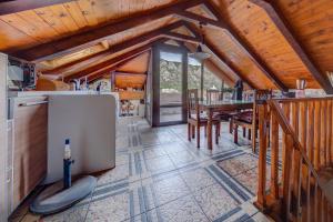 a kitchen and dining room with a table in a cabin at Mediterranean Stone Villa in Old Town in Kotor