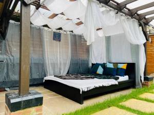 a bed under a canopy in a room at Tropical Style House Near Newcastle City Centre in Newcastle upon Tyne