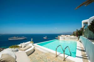 a swimming pool with a view of the ocean at Villa Ruby by Mykonos Rocks in Mýkonos City