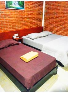 Cama o camas de una habitación en Berkah Homestay
