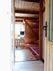 an open door to a room with a desk in a house at Il nido (Cica) in Sottoguda